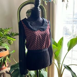 Mesh sleeved blouse with geometric print and back closure. Cute! Size M.